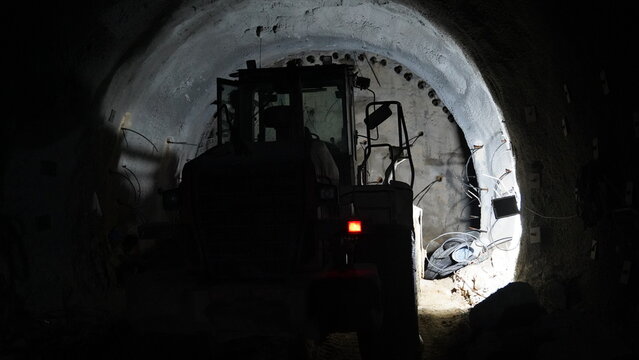work vehicle drilling into the ground in metro tunnel construction