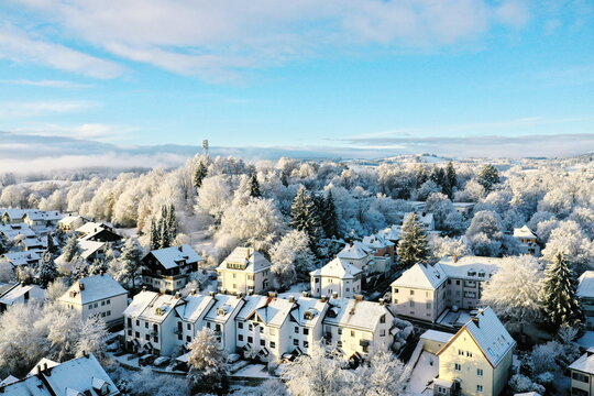 A snowy town with houses and trees