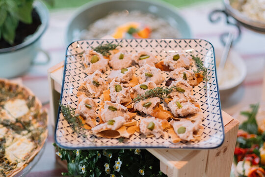 Plated appetizers with garnish displayed on a table