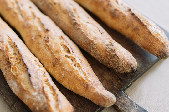 Close-up of crispy, golden baguettes with rich texture.