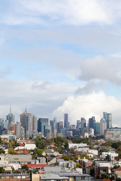 Melbourne Australia cityscape view with towering buildings and clouds