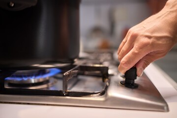 Cooking delicious meals on a modern gas stove using a sleek black pot is an art