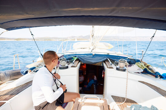 Man enjoys sailing on a boat