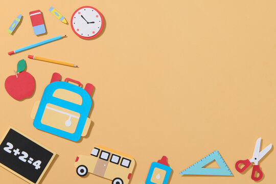 Back to School Supplies on Yellow Background