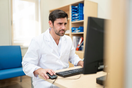 Doctor working on computer in medical office