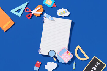 Colorful School Supplies Arranged Around an Open Notebook