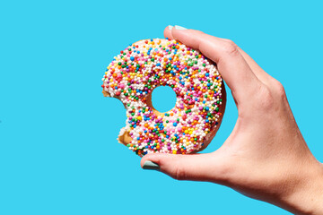 Hand Holding Sprinkle Donut 