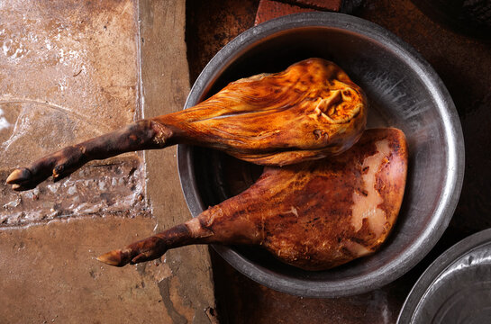 Two large hams in a basin in the kitchen