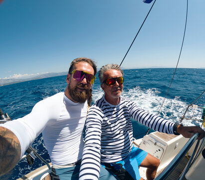 Father and son sailing on the sea