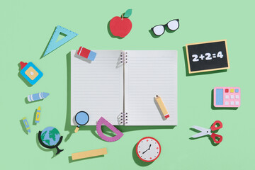Back to School Supplies on Green Background