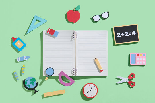 Back to School Supplies on Green Background