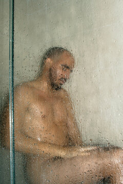 Young Man getting a shower