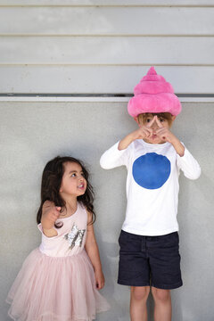 Sibliings have fun at portrait session with 'strike a pose'