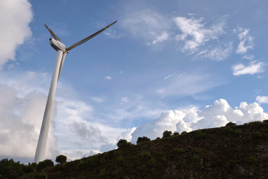 Closeup of wind turbines on high mountain plateau