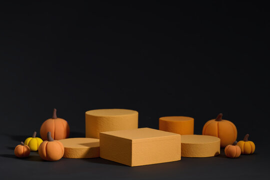Halloween Gift Boxes with Decorative Pumpkins on Dark Background