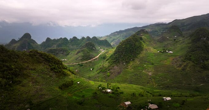 Famous motorcycle trail Ha Giang loop roads through beautiful mountain pass, Aerial