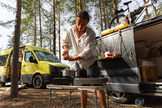 Cooking Soup At Campsite In Summer Forest