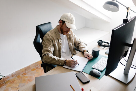 Creative professional works on his hand-drawn sketches