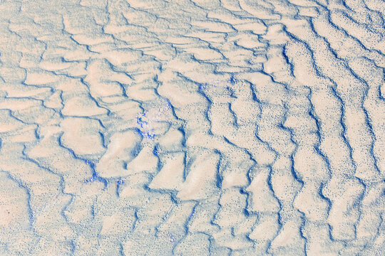 Patterns in beach sand at low tide