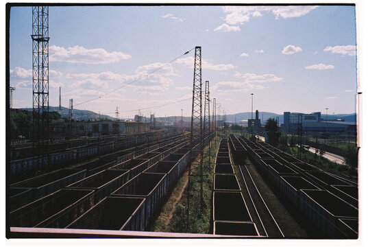 Coal train yard with empty freight containers in daylight