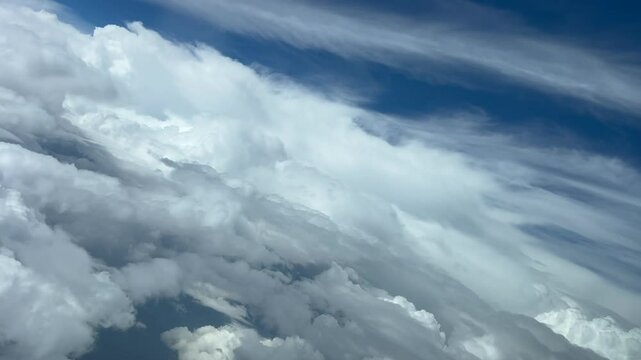 Cloudscape at the eyes of the pilot&rsquo;s of a jet doing a left turn on a stormy blue sky. Immersive pilo&rsquo;s perspective. 4K
