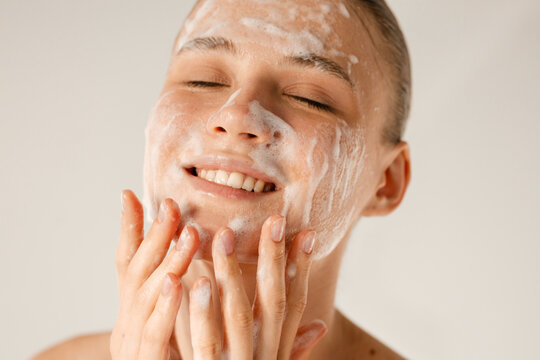 Washing face with soap beauty product 