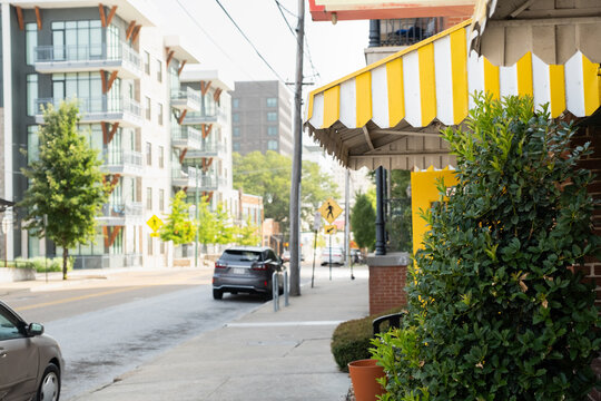 Colorful Yellow Retro Restaurant Exterior on City Street 