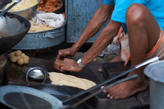 Man making chapati at Street market in Varanasi