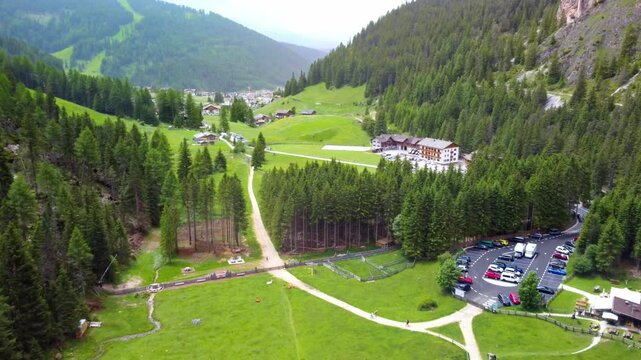 Vallunga Valley entrance, an alpine village, green meadows, dense forest. Province of Bolzano &ndash; South Tyrol, Italy