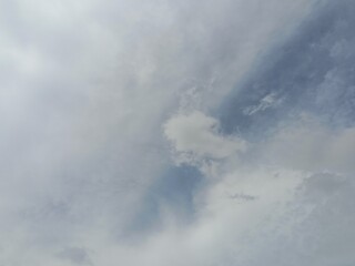 Grey clouds on blue sky in daytime. Cloud background. Presentation.