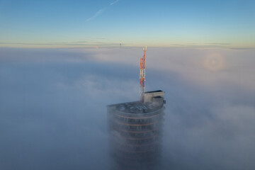 Aerial autumn morning view of skyscraper in fog, Vilnius, Lithuania