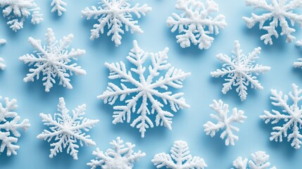 White snowflakes on a plain white or blue background