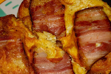 Fried bacon on toast in egg