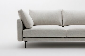 Fototapeta premium Minimalist beige sofa on white background, simplicity