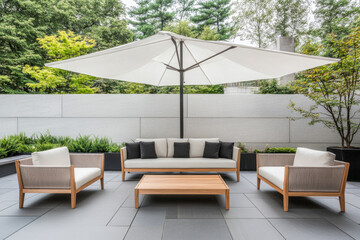 Modern outdoor seating area with umbrella and planters in a tranquil garden setting
