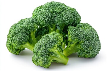Fresh green organic broccoli crowns lying on grey background