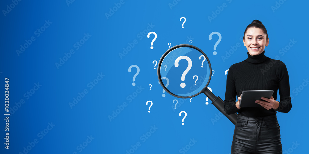 Aufkleber attractive happy young woman with tablet and abstract question marks with magnifier on blue backgrou