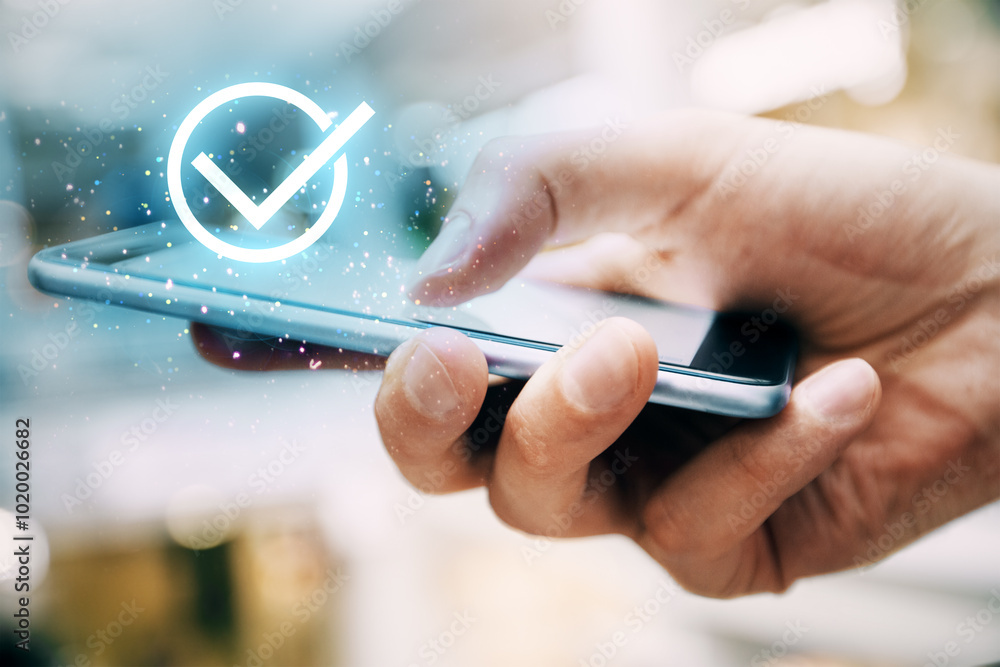 Poster close up of male hand using cellphone with digital guarantee checkmark. compliance with regulations 