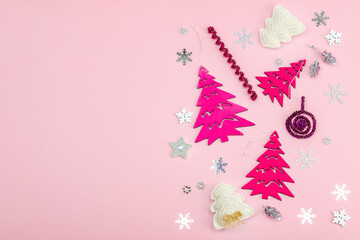 Traditional New Year composition in pink color tones. Festive decor, handmade Christmas trees