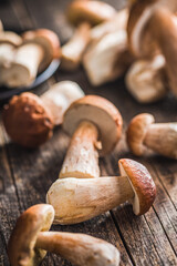 Fresh boletus mushrooms on wooden table.