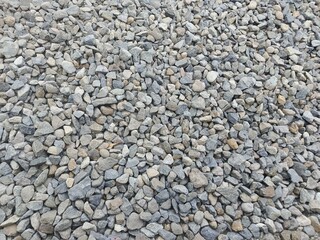 Broken stones to be placed on the sides of the railway tracks