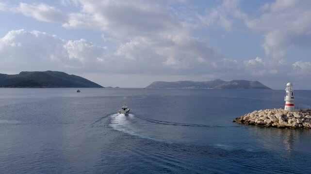 harbor with boat of Kas Turkey with becon, Tranquil bay with iconic Kas lighthouse. picturesque haven where azure waters meet coastal serenity,
