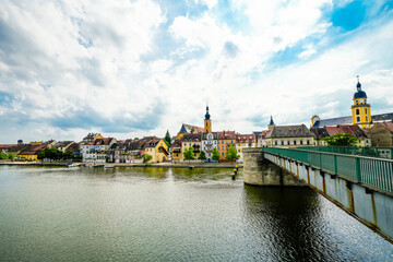 View of the Main and the Old Main Bridge in Kitzingen. Medieval stone bridge of the city.