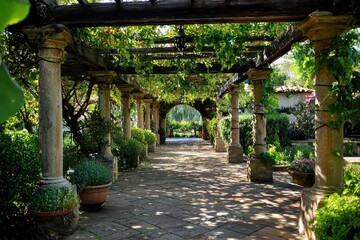 Mediterranean garden features shaded pergolas and arbors covered in lush vines.