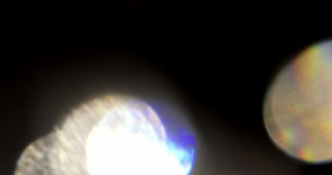 glare of light in the lens on a black background