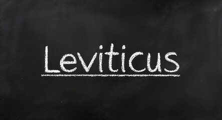 Obraz premium Leviticus text lettering on blackboard chalkboard background