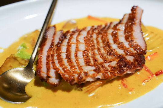 Thai food, sliced pork with curry, close up.