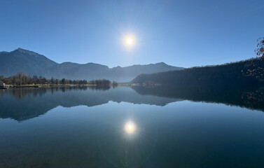 The Caldonazzo Lake With Reflections Of The Mountains In A Quiet Winter Day