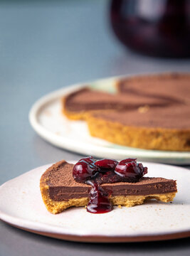 A Slice Of Speculoos Milk Ganache With Cherries Dripping
