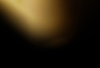 Abstract grainy golden gradient fading into black.